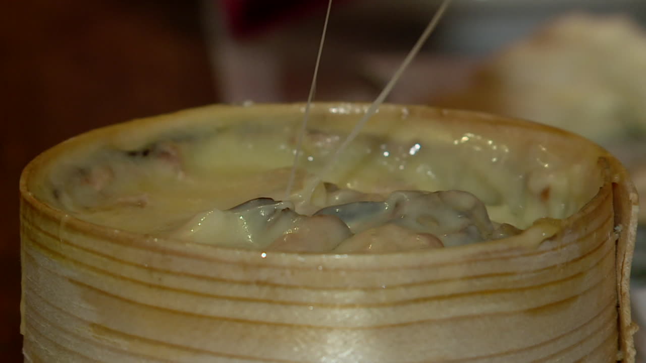 Melting Cheese in Wooden Container