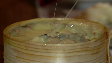 melting cheese in wooden container