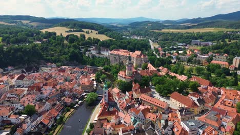 a view from above of the historic city center and movement around the castles above the city