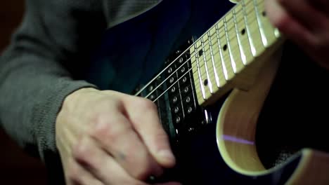 man-playing-electric-guitar-with-pick-making-music-stock-video-stock-footage