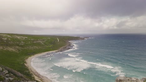 waves rolling into bay on a stormy day