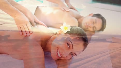 Couple-having-massage-at-spa-and-aerial-view-of-landscape-at-sunset