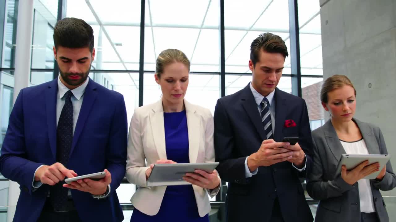 Business executives using mobile phone and digital tablet
