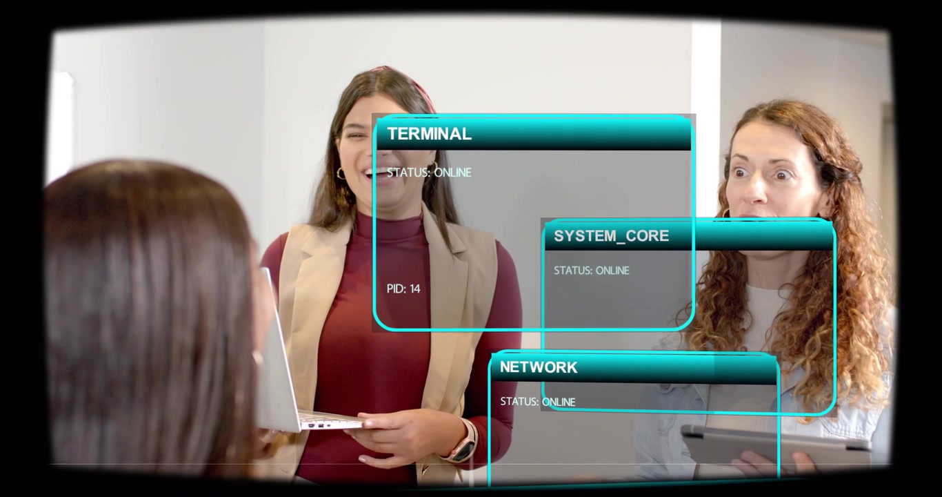 Lead woman holding laptop launching tech demo, UI panels shifting over tablet, colleagues smiling