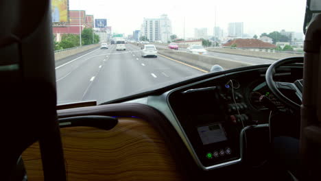 bus driver expertly navigating the expressway during a city sightseeing tour. transportation services for tourists with professional driving, offering smooth and safe travel on high-speed routes.