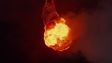 Aerial-birds-eye-overhead-top-down-view-of-crater-with-hot-magma-at-night.-Boiling-molten-lava.-Fagradalsfjall-volcano.-Iceland,-2021