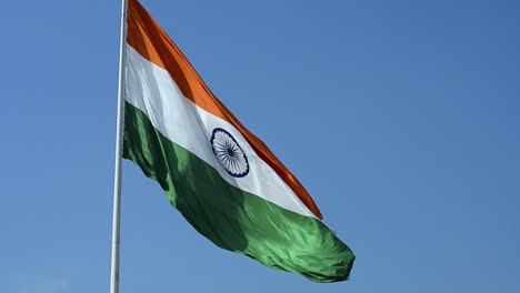 big waving indian national flag close up tricolour flying on blue sky outdoor daylight