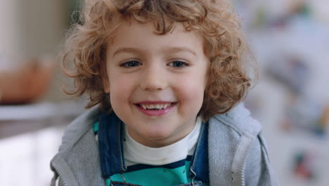 portrait happy little boy smiling at camera cute child looking cheerful expression