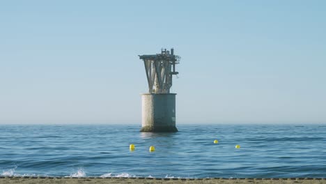 marbella beach with mine tower in the sea, centered