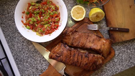 top view of typical argentinean food, grilled meat with salads