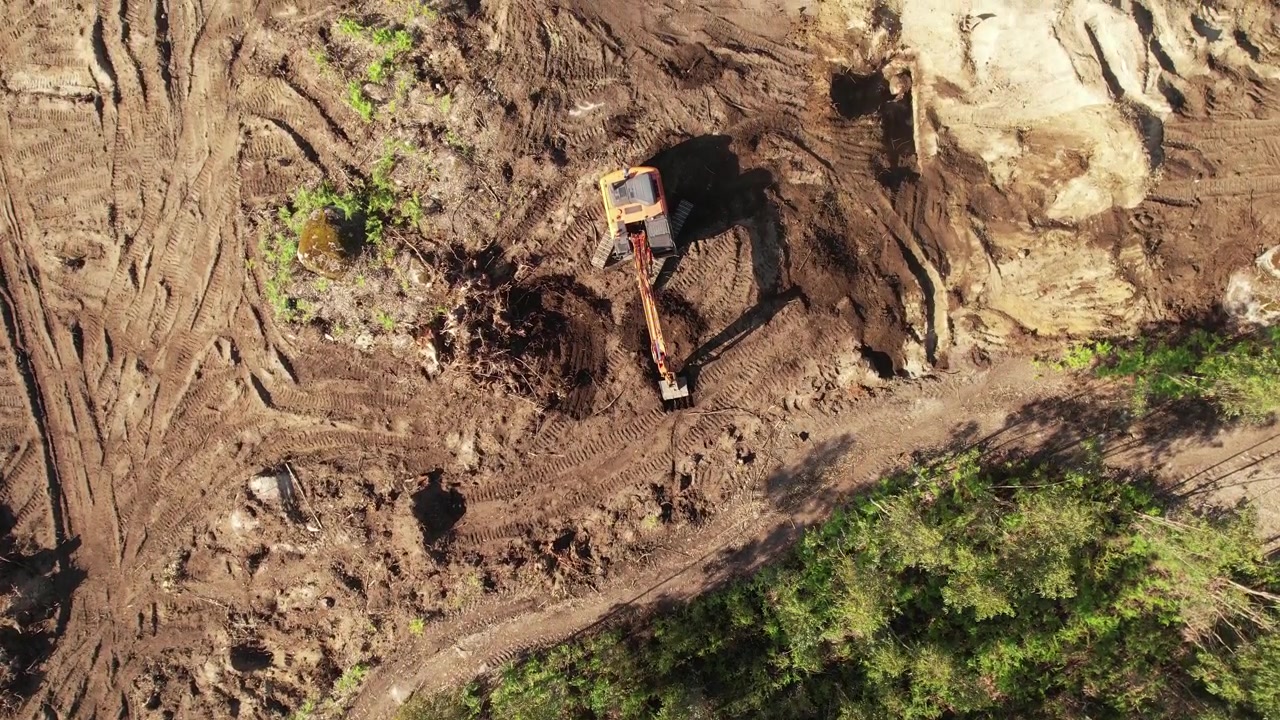 Top View of an excavator operating on a hillside