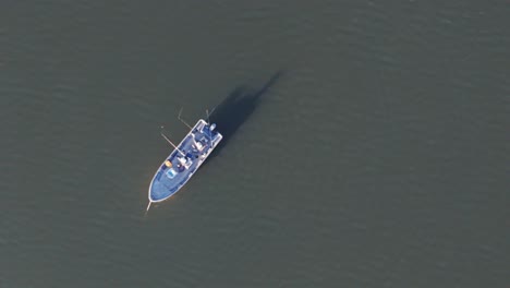 Aerial-Panning-Of-Fishermen-Fishing-From-Small-Boat