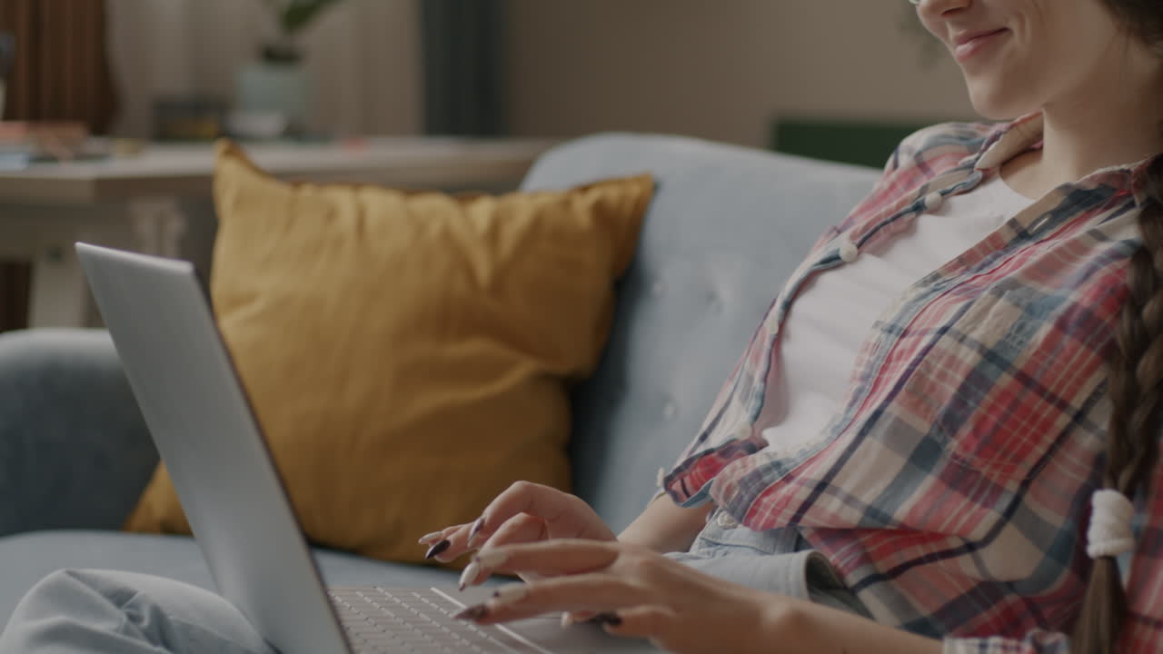 Young Woman Studying on Laptop at Home