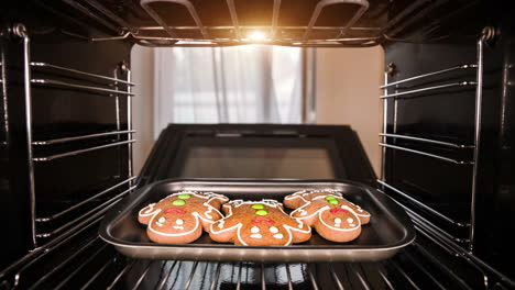 baking gingerbread man in the oven. cooking in the oven.