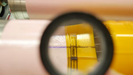 thread count or large magnification magnifying glass to see in detail the union of the templates placed before printing, industry and machinery to make chain production