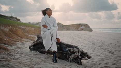 Beach-woman-talking-earphones-chatting-friend-on-weekend.-Calm-girl-rest-ocean