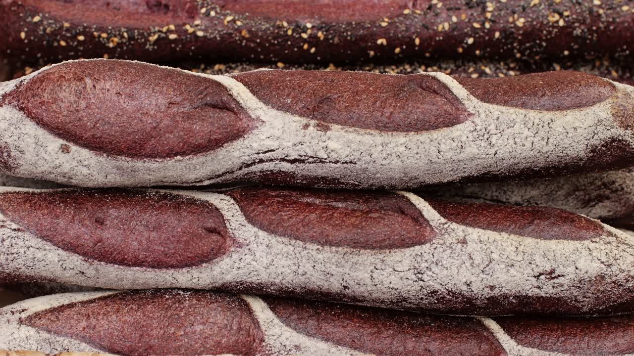 Fresh rye brown bread close-up. Artisan bread is making by skill bakers using natural and high-quality ingredients. Food with health and flavour benefits. Bakery shop and market