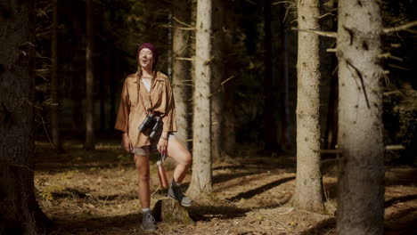 Woman-enjoying-sunlight-on-face-in-forest