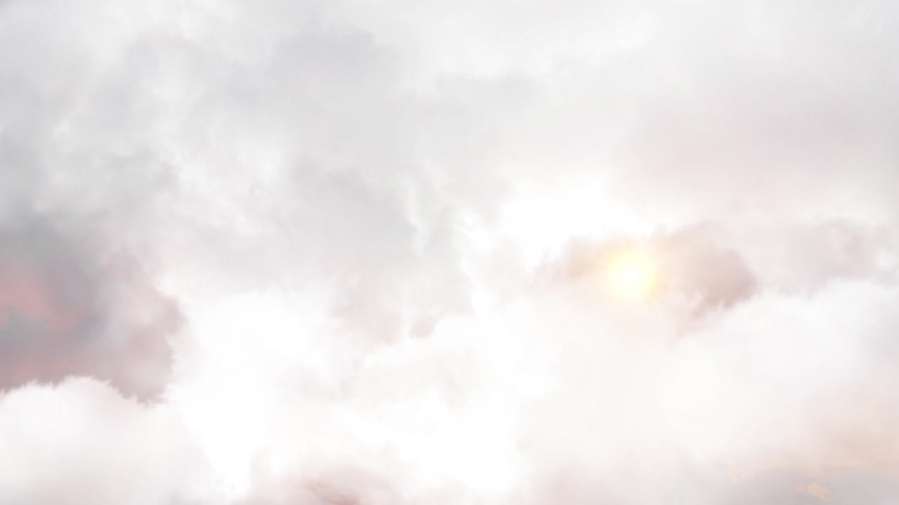 il sole che splende dietro le spesse nuvole bianche nel cielo