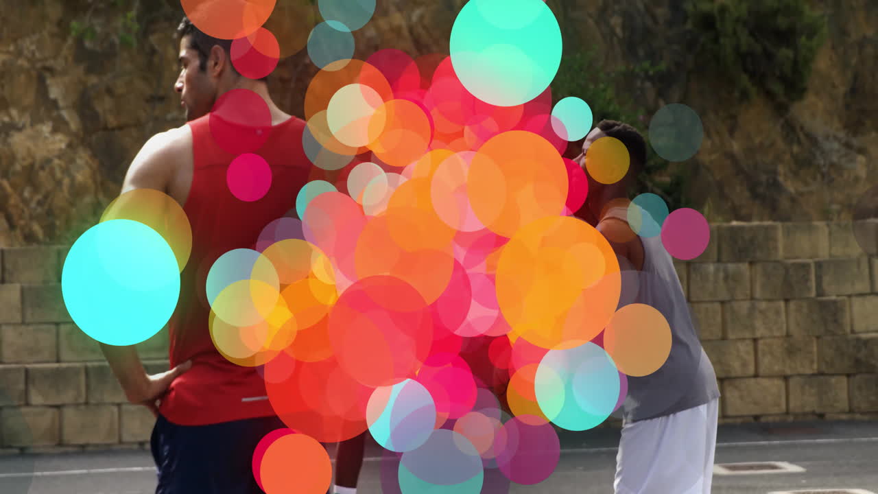 Group of teammates standing on outdoor sports court, showing sports analytics with colored circles