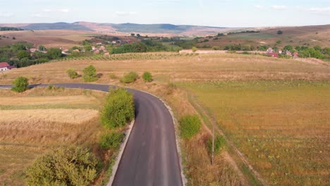 aerial view of a winding road through a rural landscape
