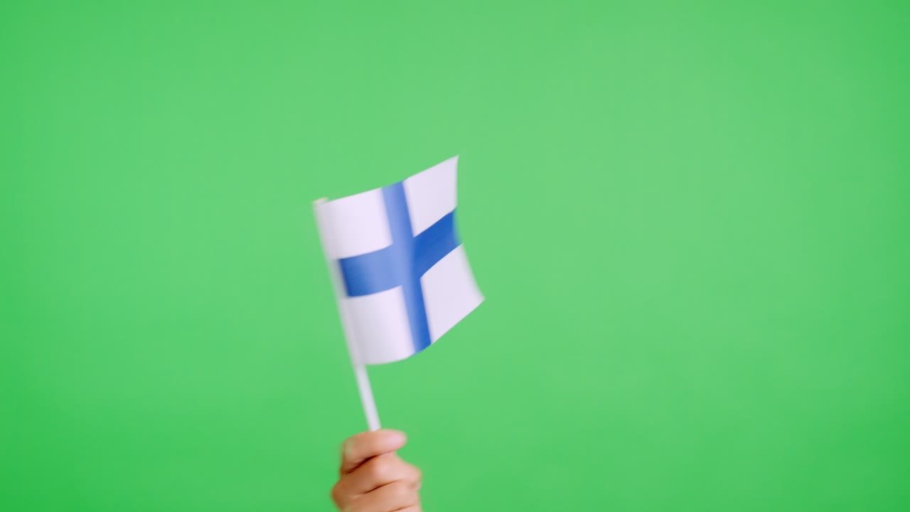 Hand waving a pennant of a finnish national flag