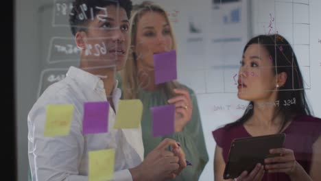 video of diverse female and male coworkers brainstorming, working late in office