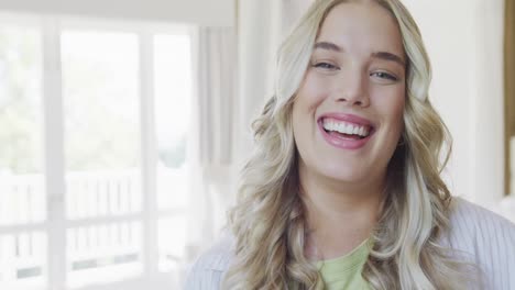 portrait of happy caucasian plus size woman at home in slow motion