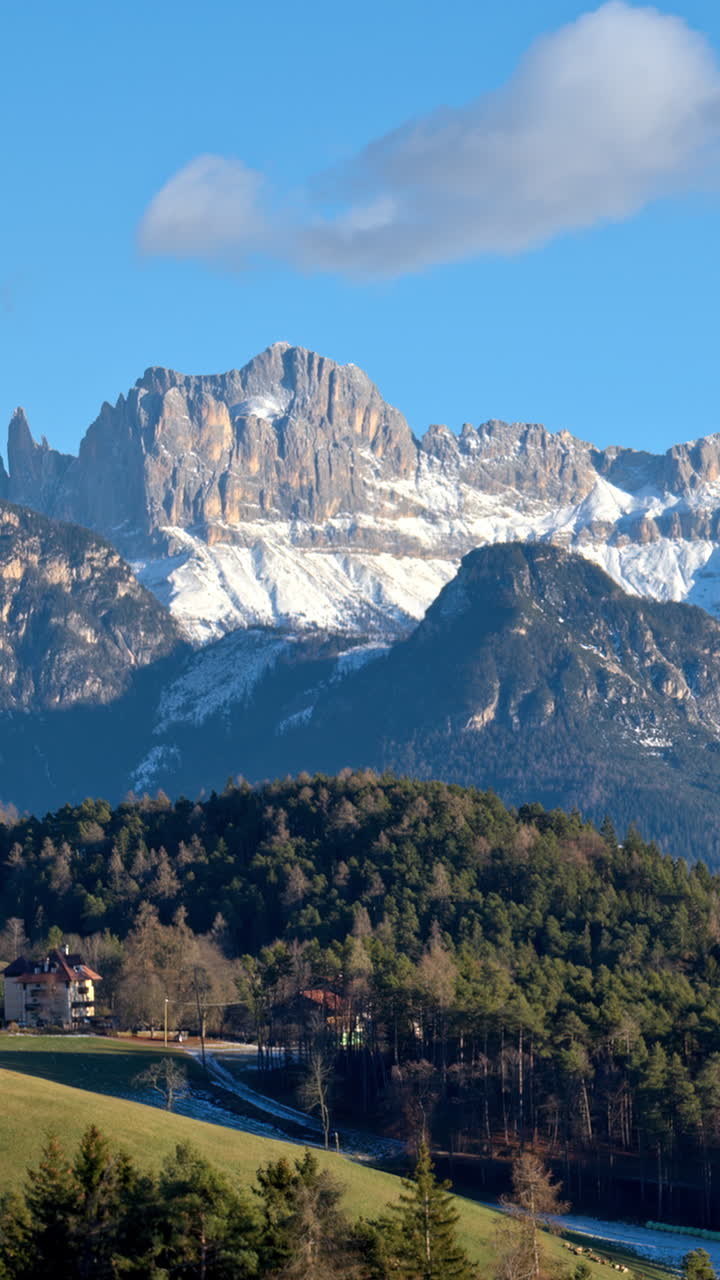 Distant view of snow on the mountains in the Dolomites, Italy. Vertical