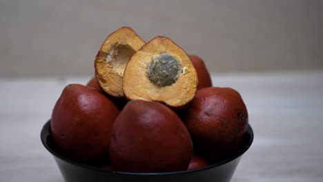 4K-close-up-of-chonta-fruit-on-bowl-growing-of-Bactris-gasipae-Palm-in-South-America