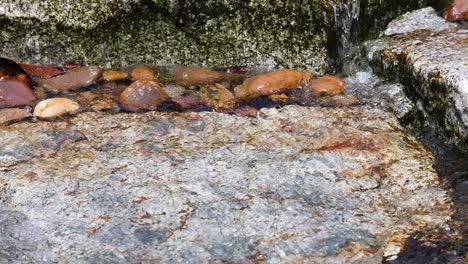 water flowing over rocks in khao yai