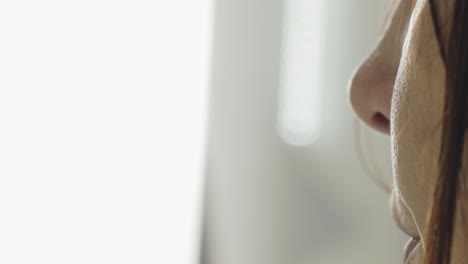 super closeup of brunette caucasian woman brushing hair