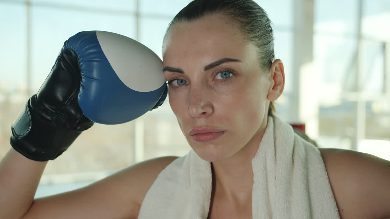 Woman resting after boxing training
