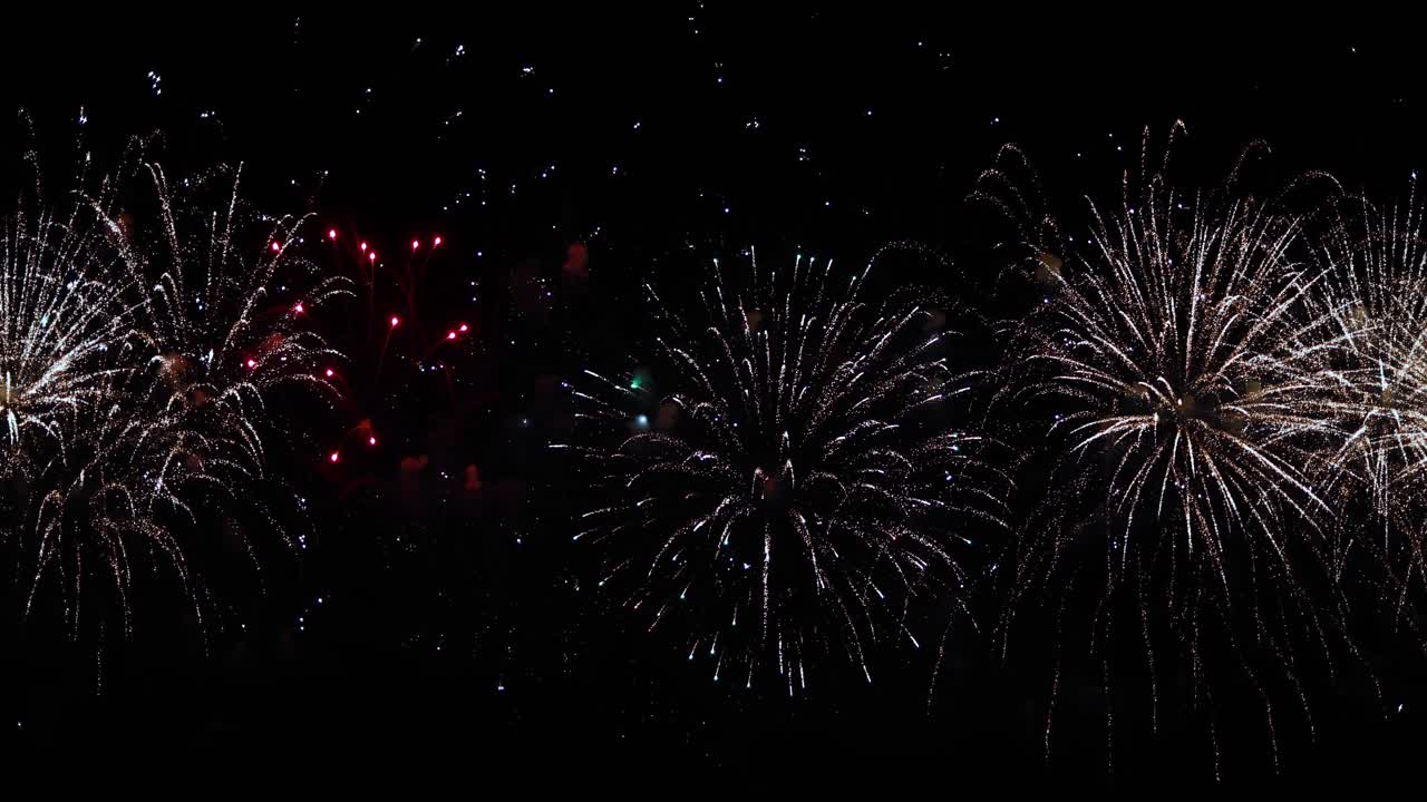Colorful fireworks exploding in the night sky. Celebrations and events in bright colors.