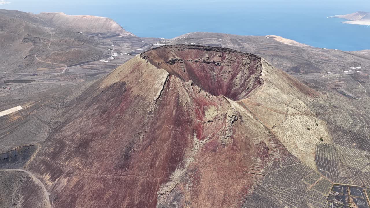 Volcán de La Corona Extinct Volcano Near Yé Village In The Municipality Of Haría On The Northeast Of Lanzarote, Spain. Aerial Ascending Shot