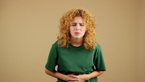 woman suffering from stomach or abdominal pain