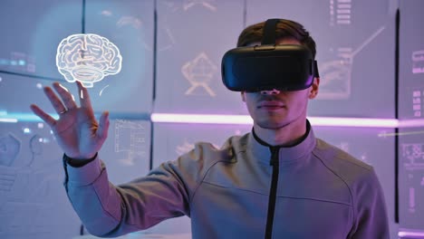 man using vr headset to interact with brain hologram