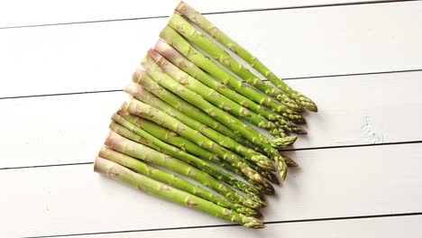 Above-view-of-flat-lay-organic-raw-uncooked-green-asparagus