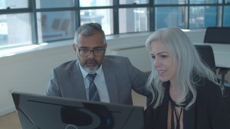 focused business colleagues watching project presentation