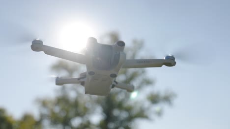 Drone-flying-in-air-with-sun-flares-around-it