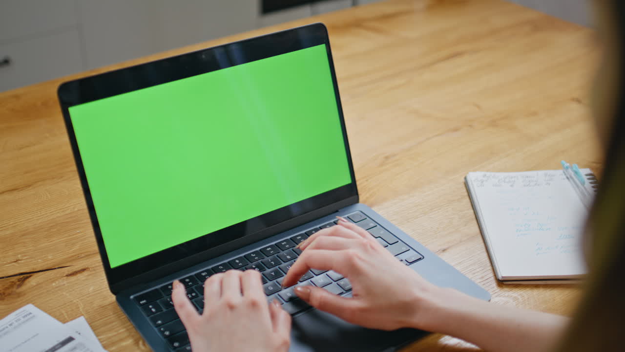 Hands typing email chroma key laptop at workplace closeup. Woman working online