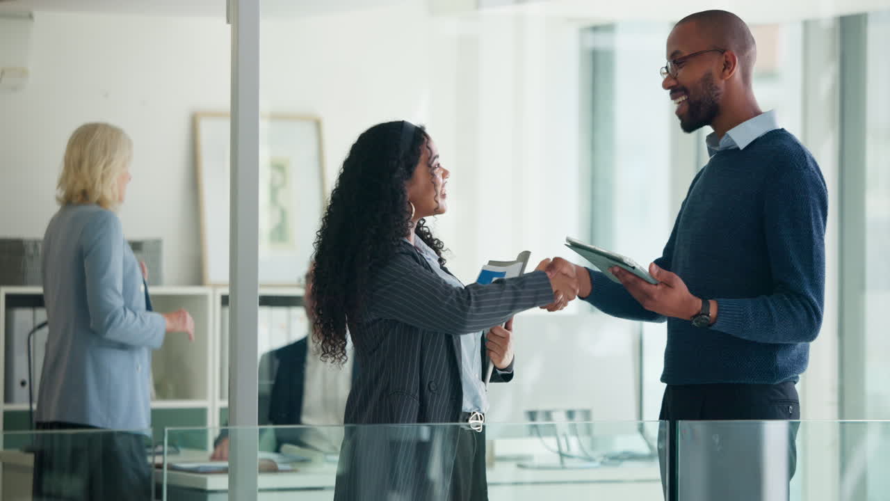 Diverse Business People Shaking Hands and Collaborating in Modern Office