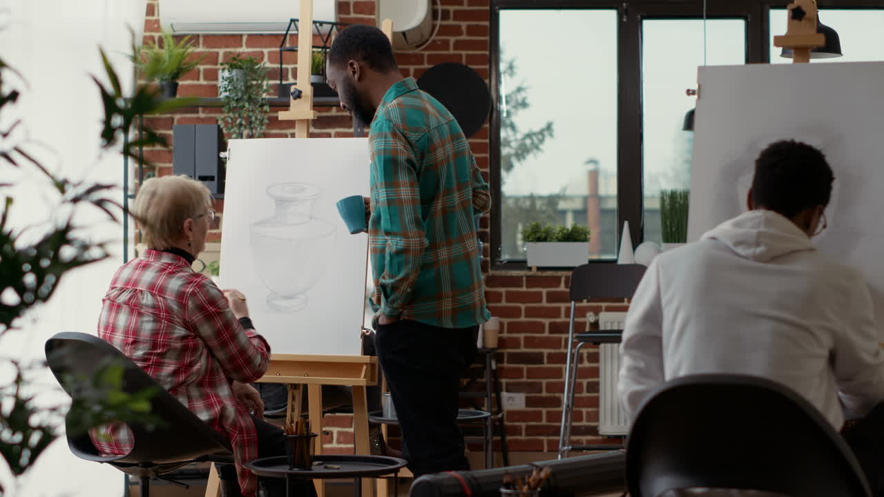 Modern artist analyzing vase drawing by senior woman