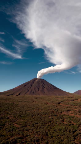 volcano emitting a large plume of smoke