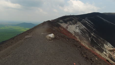 POV-walking-on-ash-rim-of-Cerro-Nego-Volcano-crater-in-Nicaragua