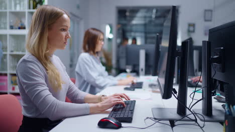 A businesswoman working at a desk in an office