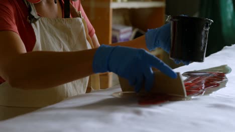 woman making surfboard 4k