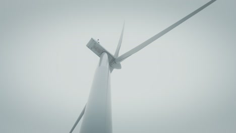 wind turbine in misty conditions