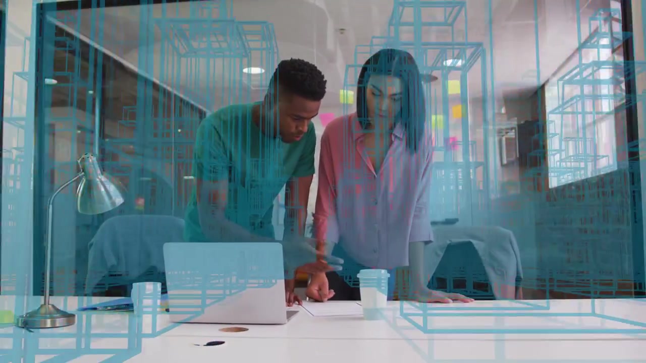 Man pointing then marking paper while woman observing, reviewing business plans through cyan grid