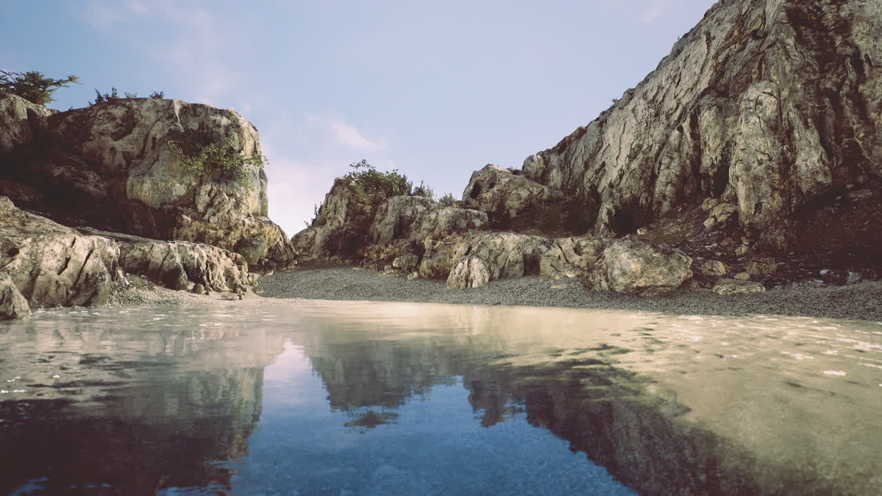 Tranquil rocky landscape with calm waters reflecting the sky